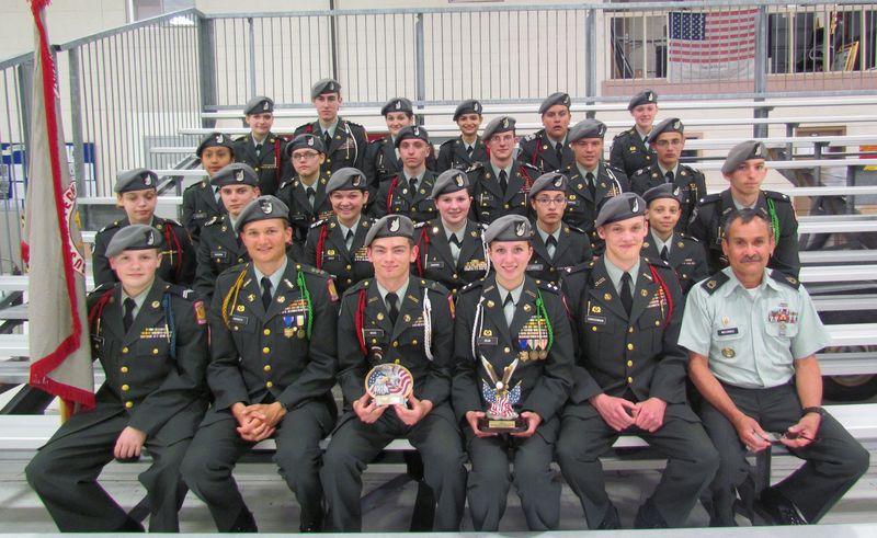 Raven Battalion JROTC Drill Team members show off their awards from the Eagle Classic. In back are (l-r) Mikala Herlihy, Seaford; Colin Hearn, Laurel; Emily Tirado, Frankford; Margaret Legates, Georgetown; Matthew Zwiebel, Millsboro; and Branagh James, Bridgeville; third row, Dana Ramirez, Georgetown; Michaela Anderson, Millsboro; Bradley Gordon, Milton; Nikales Joseph, Seaford; Andrew Hartman, Bridgeville; and Jerry Legates, Georgetown; second row, Brittany Yeo, Millsboro; Alex Hassman, Greenwood; Emma Rider, Bridgeville; Samantha Hawkins, Georgetown; Megan Legates, Georgetown; Spencer Turner, Georgetown; and Andrew Atkins, Millsboro). In front are Joseph Hartman, Bridgeville; Dylan Varrato, Georgetown; Armed Exhibition Leader Tyler Wood, Laurel; Unarmed Exhibition Leader Kaycee Bean, Laurel; Robert Christensen, Harbeson; and Sgt. Luis Melendez. SOURCE SUBMITTED